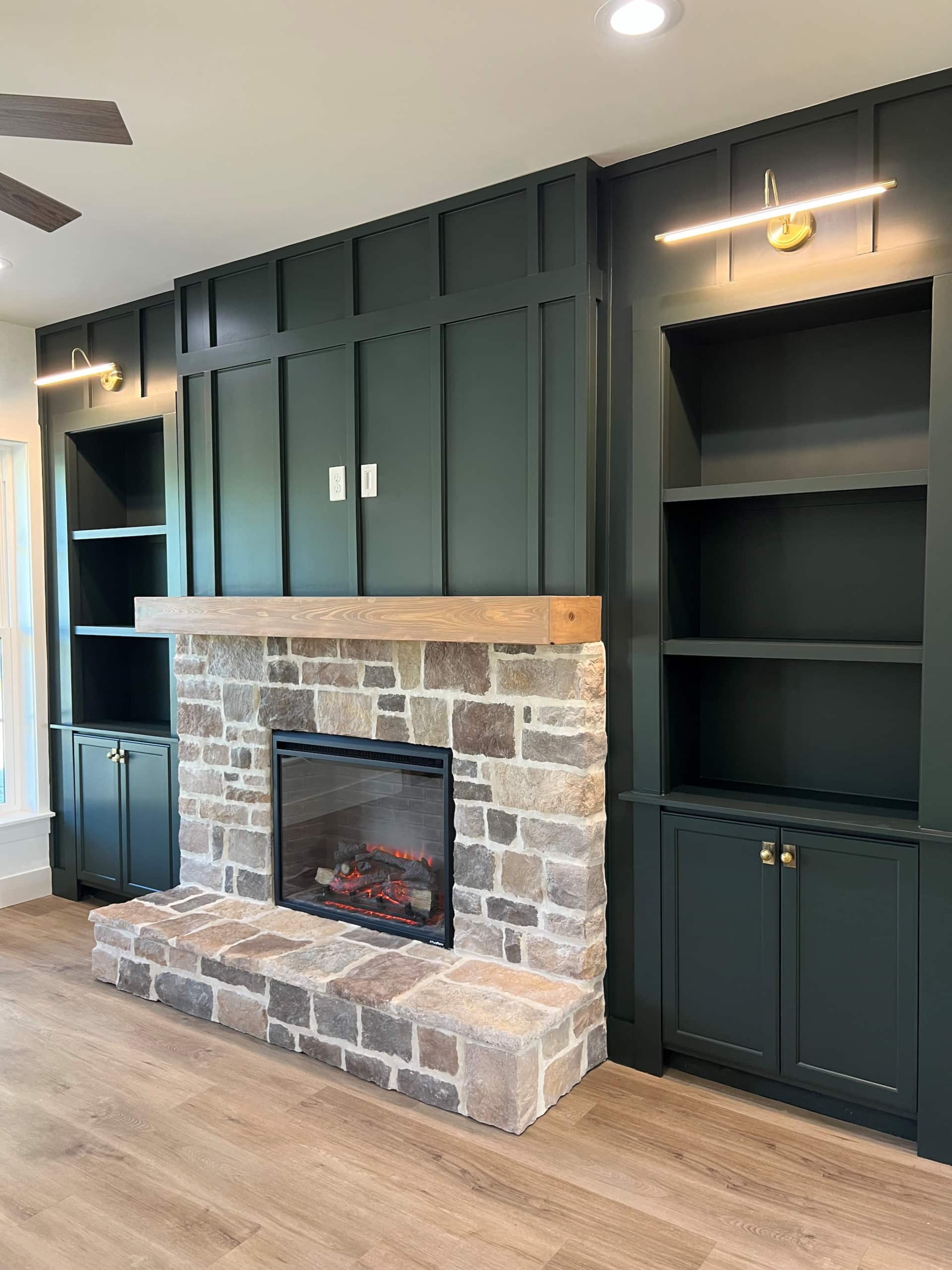 Stone fireplace with wooden mantel in living room